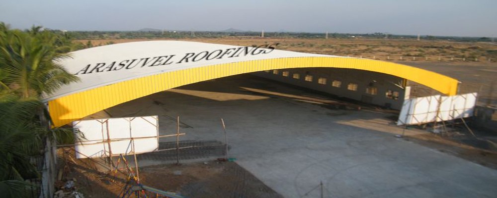 Industrial metal roofing sheet installed by Arasuvel Roofings for a large-span warehouse building in Tamil Nadu